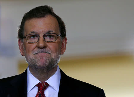 FILE PHOTO: Spanish Prime Minister Mariano Rajoy reacts as he gives a year-end news conference at Moncloa palace in Madrid, Spain, December 30, 2016. REUTERS/Andrea Comas/File Photo