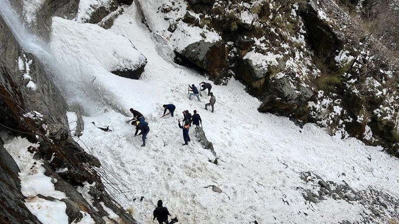 Rescue team members search for survivors after an avalanche in the northeastern state of Sikkim