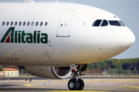 An Alitalia airplane is seen before take off from the Leonardo da Vinci-Fiumicino Airport in Rome, Italy, June 21, 2018. REUTERS/Stefano Rellandini