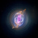 This image is NGC 6543 known as the Cat's Eye Nebula as it appears to the Chandra X-Ray Observatory and Hubble Telescope. A planetary nebula is a phase of stellar evolution that the sun should experience several billion years from now, when it