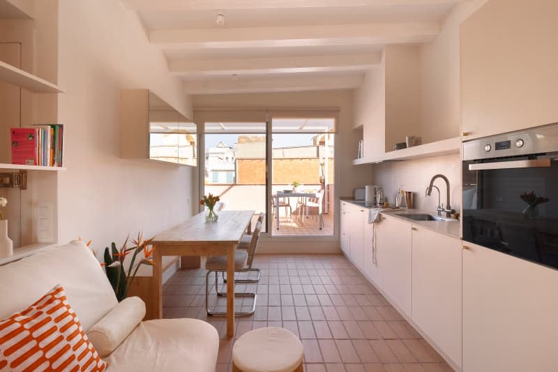 View into outdoor patio area of city apartment.