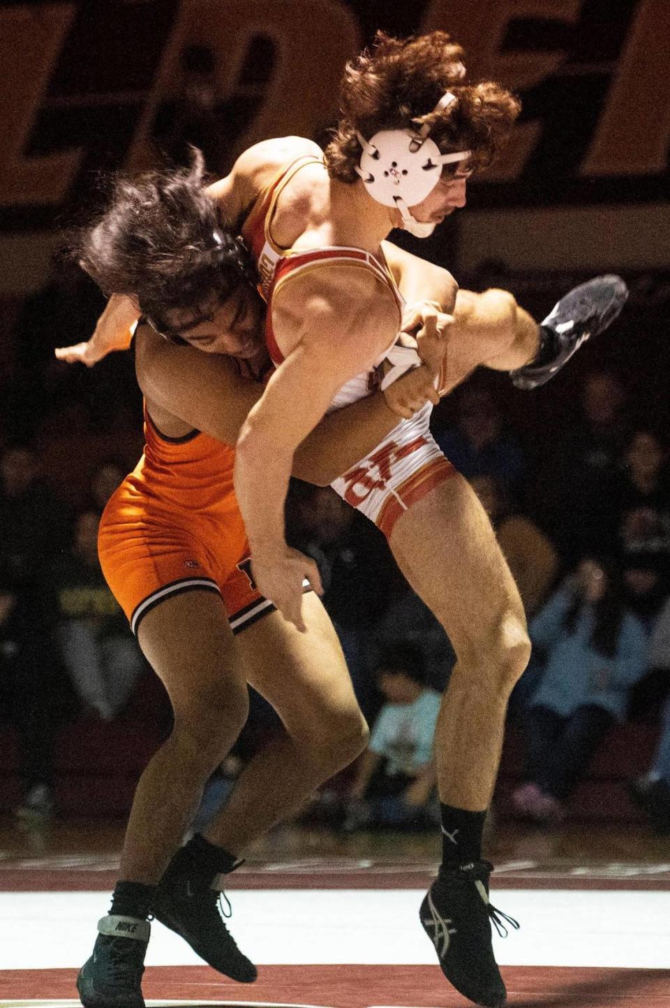 Merced’s Angel Valenzuela throws Golden Valley’s Jayden Richards to the mat during a wrestling match at Golden Valley High School in Merced, Calif., on Tuesday, Jan. 23, 2024.