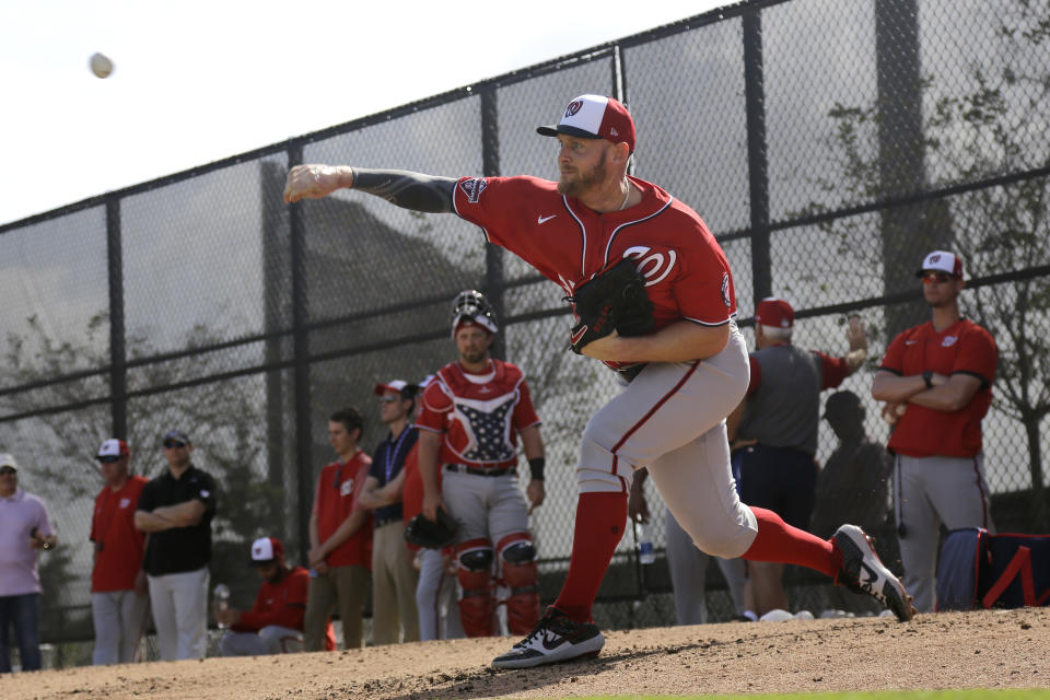 Washington Nationals pitcher Stephen Strasburg throws a bullpen session during spring training baseball practice Friday, Feb. 14, 2020, in West Palm Beach, Fla. (AP Photo/Jeff Roberson)