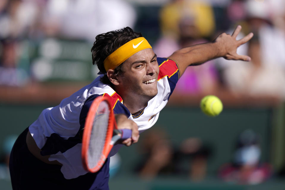 Taylor Fritz, of the United States, returns to Alexander Zverev, of Germany, at the BNP Paribas Open tennis tournament Friday, Oct. 15, 2021, in Indian Wells, Calif. (AP Photo/Mark J. Terrill)