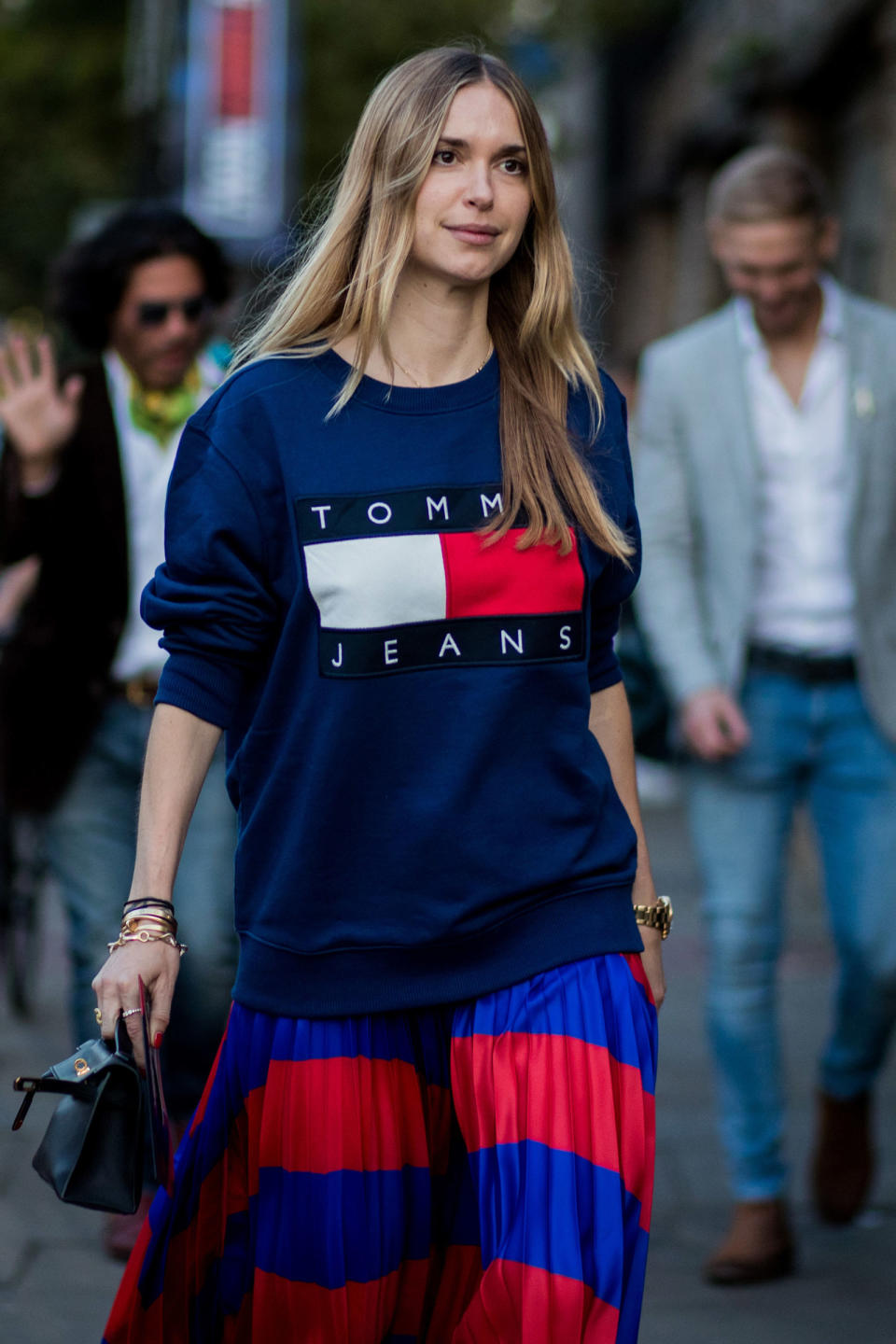 <p>Throw a logo sweatshirt over your pleated skirt for a refreshing take on the ladylike trend.</p>