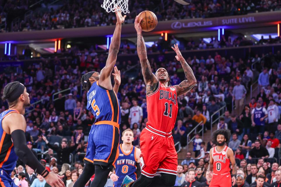 Apr 14, 2024; New York, New York, USA; Chicago Bulls forward DeMar DeRozan (11) drives past New York Knicks forward Precious Achiuwa (5) in overtime at Madison Square Garden. Mandatory Credit: Wendell Cruz-USA TODAY Sports