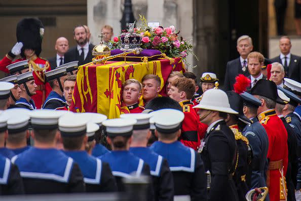 LONDON, ENGLAND - SEPTEMBER 19: The coffin of Queen Elizabeth II is placed on a gun carriage during the State Funeral of Queen Elizabeth II at Westminster Abbey on September 19, 2022 in London, England.  Elizabeth Alexandra Mary Windsor was born in Bruton Street, Mayfair, London on 21 April 1926. She married Prince Philip in 1947 and ascended the throne of the United Kingdom and Commonwealth on 6 February 1952 after the death of her Father, King George VI. Queen Elizabeth II died at Balmoral Castle in Scotland on September 8, 2022, and is succeeded by her eldest son, King Charles III. (Photo by Emilio Morenatti - WPA Pool/Getty Images)