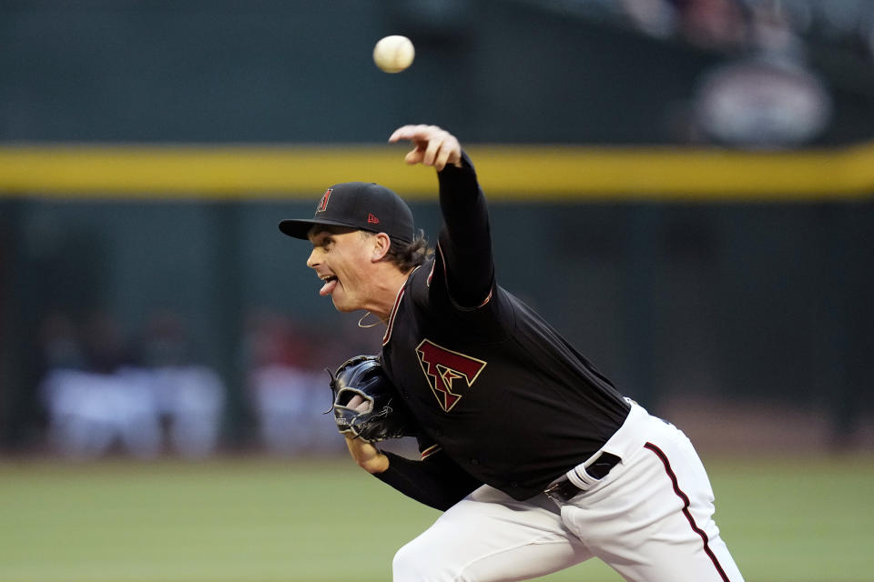 Arizona Diamondbacks starting pitcher Tommy Henry throws to a Colorado Rockies batter during the first inning of a baseball game Wednesday, May 31, 2023, in Phoenix. (AP Photo/Ross D. Franklin)