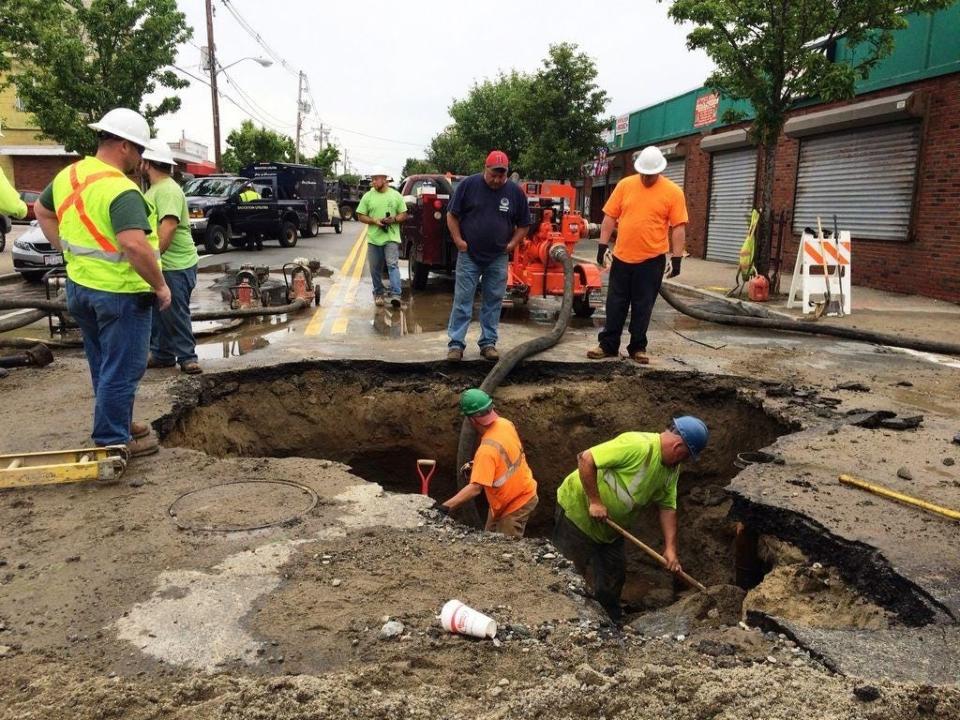 Crews work to fix a water main break on Main Street near the intersection of West Chestnut Street in Brockton on June 11, 2016. (Marc Vasconcellos/The Enterprise)