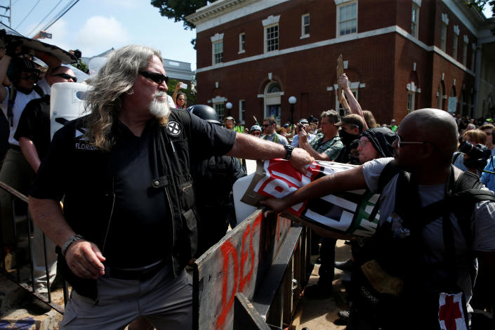 <p>A white supremacist grabs a counter protesters’ sign during a rally in Charlottesville, Virginia, U.S., August 12, 2017. (Photo: Joshua Roberts/Reuters) </p>