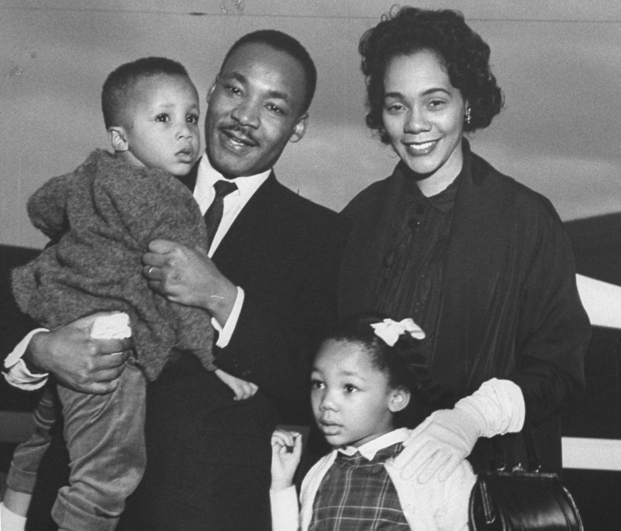 Civil Rights ldr. Dr. Martin Luther King Jr. holding his son Martin III as his daughter Yolanda and wife Coretta greet him at the airport upon his release from Georgia State prison after incarceration for leading boycotts