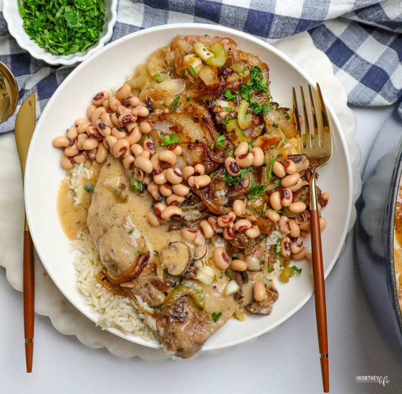 <p>This Worthey Life</p><p>This easy Braised Smothered Pork + Black-Eyed Peas is 100% comfort food with a bit of luck thrown in for good measure.</p><p><strong>Get the Recipe: </strong><strong><a href="https://www.awortheyread.com/braised-smothered-pork/" rel="nofollow noopener" target="_blank" data-ylk="slk:Braised Smothered Pork and Black Eyed Peas;elm:context_link;itc:0;sec:content-canvas" class="link rapid-noclick-resp">Braised Smothered Pork and Black Eyed Peas</a></strong></p><p><strong>Related: <a href="https://parade.com/243931/lorilange/5-black-eyed-pea-recipes-for-good-luck-in-the-new-year/" rel="nofollow noopener" target="_blank" data-ylk="slk:10 Best Black-Eyed Pea Recipes To Bring Luck;elm:context_link;itc:0;sec:content-canvas" class="link rapid-noclick-resp">10 Best Black-Eyed Pea Recipes To Bring Luck</a></strong></p>