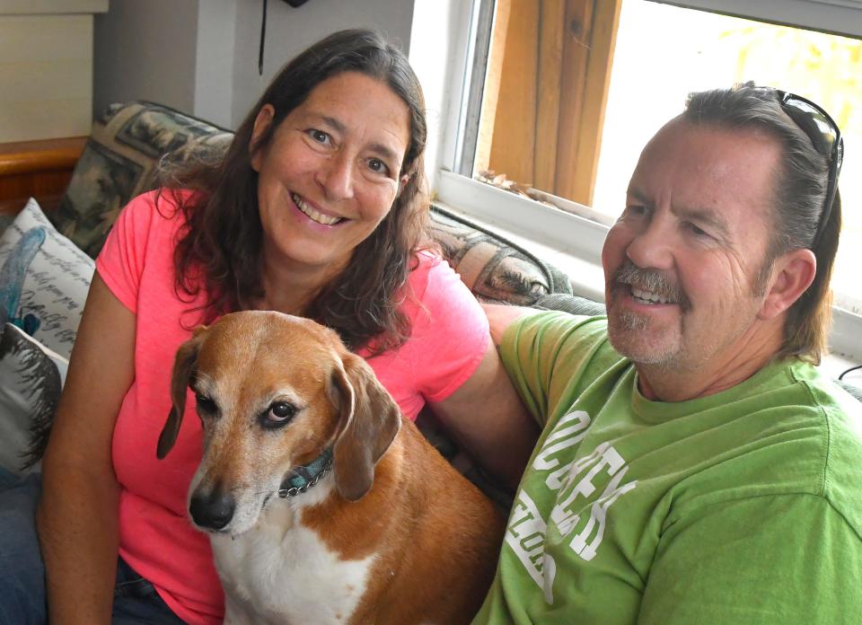 Michelle and Paige Green relax at home on Merritt Island with their dog, Ellie May.