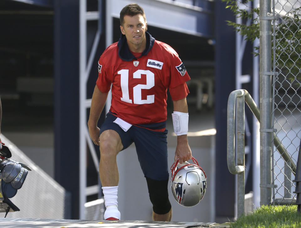 New England Patriots quarterback Tom Brady steps on the field at the start of an NFL football training camp practice, Thursday, July 25, 2019, in Foxborough, Mass. (AP Photo/Steven Senne)