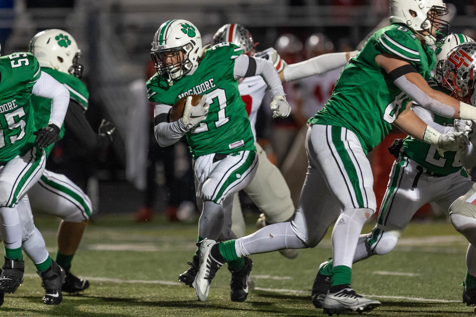 Mogadore junior Austin Constantine runs the ball during a regional semifinal Nov. 12, 2022, against Cuyahoga Heights in Twinsburg.