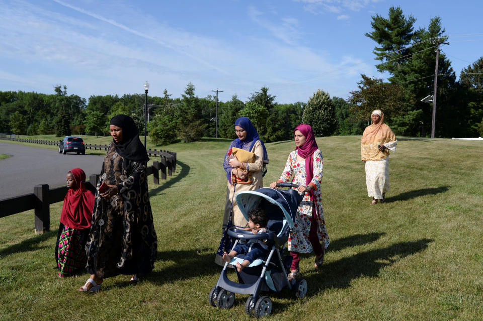 Muslim women walk to a nearby park to take part in Eid al-Fitr prayers in South Brunswick Township, New Jersey, U.S., on June 25, 2017.&nbsp;