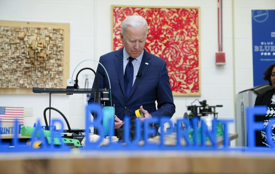 President Joe Biden tours the Cuyahoga Community College Manufacturing Technology Center, Thursday, May 27, 2021, in Cleveland. (AP Photo/Evan Vucci)