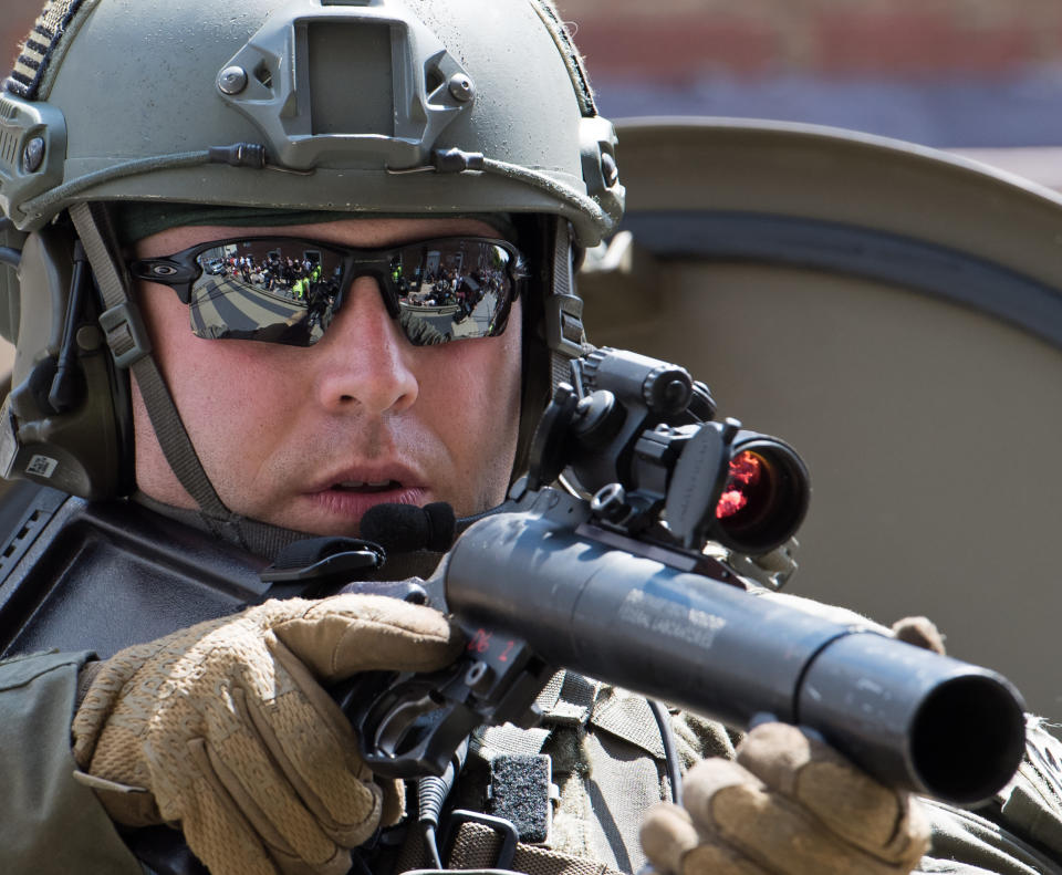 <p>A Virginia State Trooper secures the area were a car ran into a crowd of protesters on August 12, 2017, downtown Charlottesville, Va. (Photo: Paul J. Richards/AFP/Getty Images) </p>