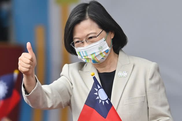 Taiwanese President Tsai Ing-wen gives a thumbs-up sign as she attends a ceremony to mark the island's National Day in front of the Presidential Office in Taipei on Oct. 10, 2022.