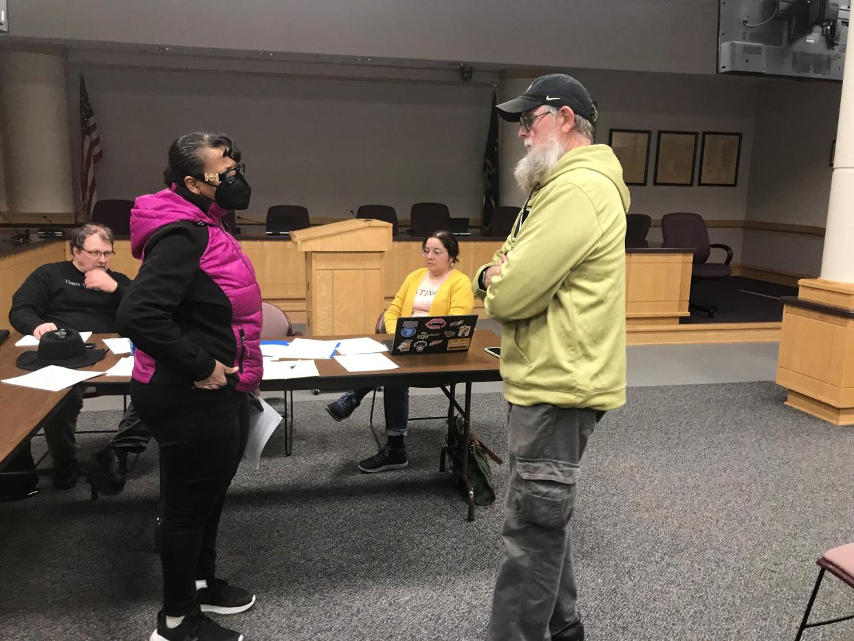 Fairfield Township employee Cheryl Watkins and Fairfield Township Board President Perry Schnarr talk after Thursday's emergency board meeting after Trustee Taletha Coles resigned on Wednesday. It is not yet clear whether Watkins or Schnarr is the interim trustee.