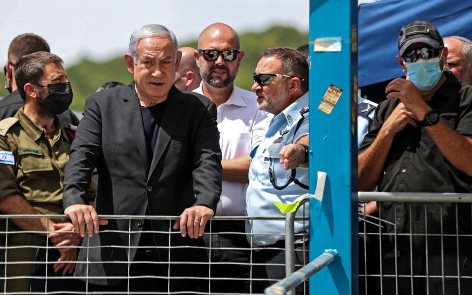 Benjamin Netanyahu was met with boos when he visited the site the stampede on Friday - Ronen Zvulun/AFP