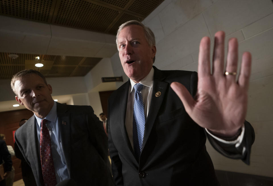 Rep. Mark Meadows, R-N.C., a member of the House Committee on Oversight and Reform, joined at left by Rep. Scott Perry, R-Pa., gives his impressions of the day-long meeting behind closed-doors with Kurt Volker, a former special envoy to Ukraine, as House Democrats proceed with the impeachment investigation of President Donald Trump, at the Capitol in Washington, Thursday, Oct. 3, 2019. (AP Photo/J. Scott Applewhite)