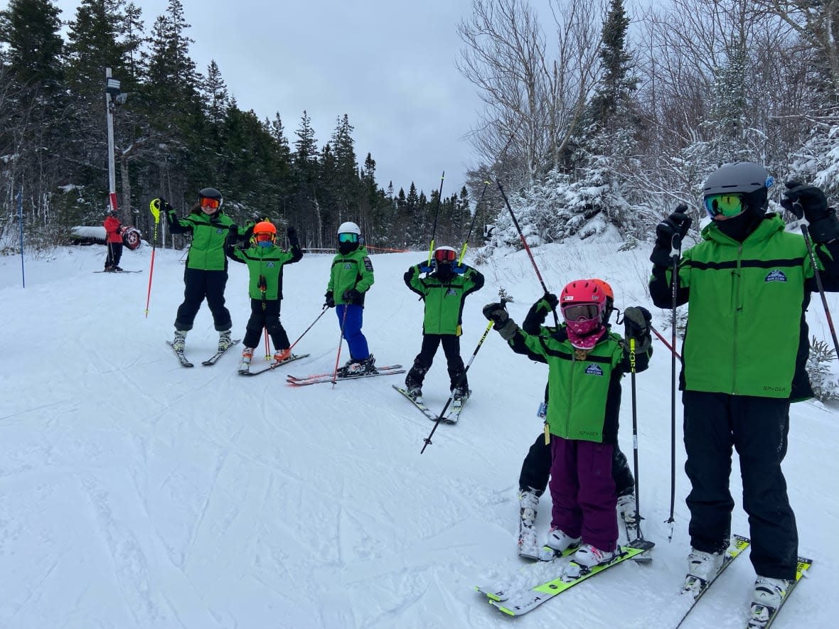 Skiiers celebrate the opening day at Ski Ben Eoin in Cape Breton.  (Submitted by Darcy MacDonald - image credit)