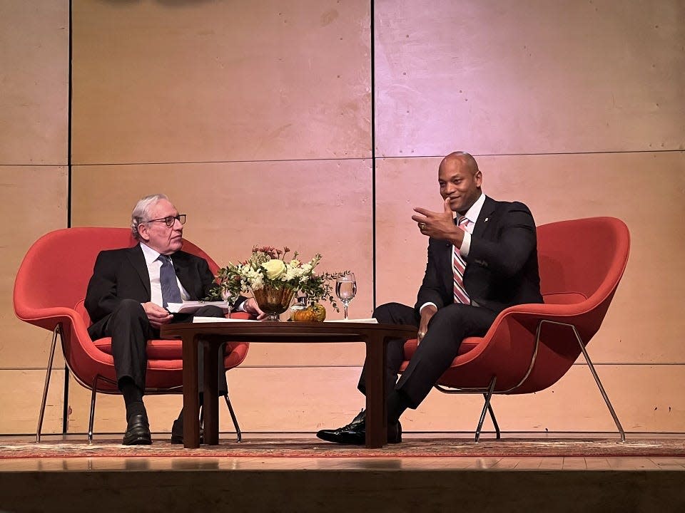 Washington Post Associate Editor Bob Woodward, left, listens to Maryland Gov. Wes Moore, right, during the "Great Conversation Series" at St. John's College in Annapolis, Maryland on Oct. 29, 2023. Moore said the state moved up 20 slots in economic momentum rankings.