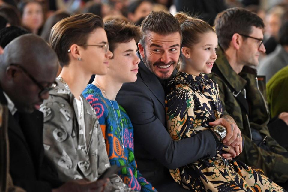 Romeo, Cruz, Harper and David sit front row at Victoria’s latest eponymous show in Paris (AFP via Getty Images)