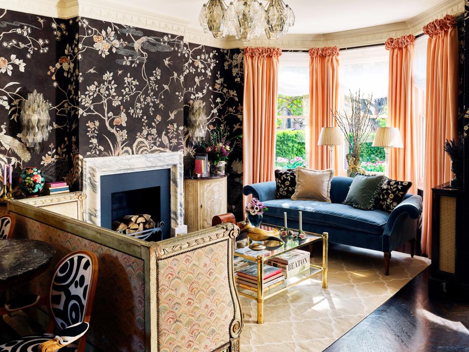 A de Gournay chinoiserie nodding to Coco Chanel’s Paris apartment wraps the living room. De Gournay silk curtains, sofa, and pillows; Jennifer Manners rug.