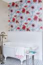 <p>If there's one room that can benefit from a dose of drama, it's the bathroom. A wallpaper boasting bold blooms is a no-fail option for a quick refresh.</p>