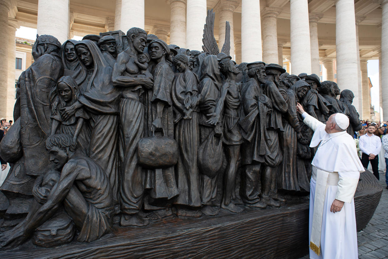 Pope Francis attends the unveiling Sunday of the sculpture commemorating migrants and refugees by Canadian artist Timothy Schmaltz in St Peter's Square in Vatican City. (Photo: Vatican Media / Reuters)