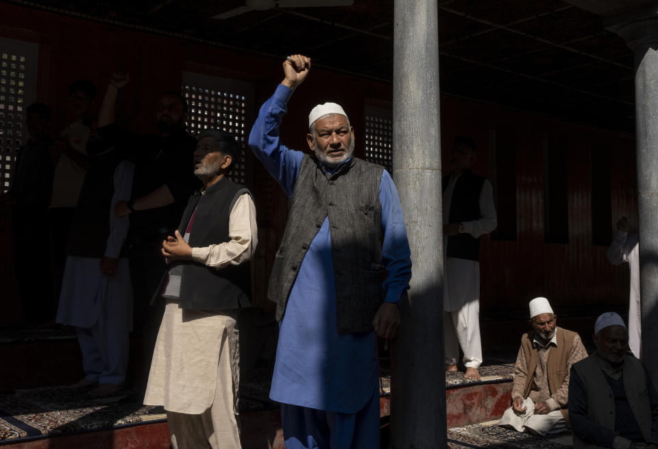 FILE- An elderly Kashmiri shouts slogans against Israel's military operations in Gaza, inside a mosque in Budgham, northeast of Srinagar, Indian controlled Kashmir, Oct. 13, 2023. In Indian-controlled Kashmir, known for its vocal pro-Palestinian stance, authorities have barred any solidarity protest and asked Muslim preachers not to mention the conflict in their sermons. Analysts say the new restrictions on speech reflect a shift in India’s foreign policy under the populist Prime Minister Narendra Modi away from its long-held support for the Palestinians. (AP Photo/ Dar Yasin, File)