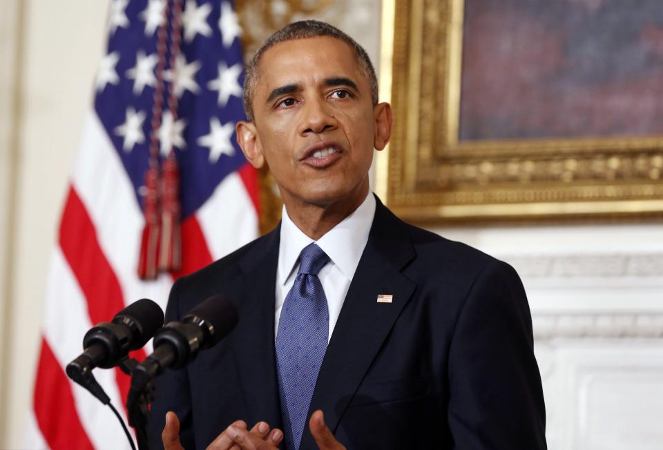 U.S. President Barack Obama talks about the humanitarian relief situation in Iraq, at the State Dining Room of the White House in Washington August 7, 2014. REUTERS/Larry Downing (UNITED STATES - Tags: POLITICS)