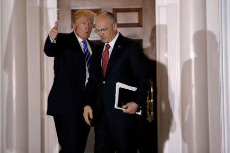 FILE PHOTO - U.S. President-elect Donald Trump gestures as Andy Puzder, CEO of CKE Restaurants, departs after their meeting at the main clubhouse at Trump National Golf Club in Bedminster, New Jersey, U.S. on November 19, 2016. REUTERS/Mike Segar/File Photo