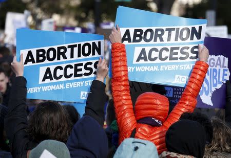 Protesters demonstrate in front of the U.S. Supreme Court in the morning as the court takes up a major abortion case focusing on whether a Texas law that imposes strict regulations on abortion doctors and clinic buildings interferes with the constitutional right of a woman to end her pregnancy, in Washington March 2, 2016. REUTERS/Kevin Lamarque/File Photo