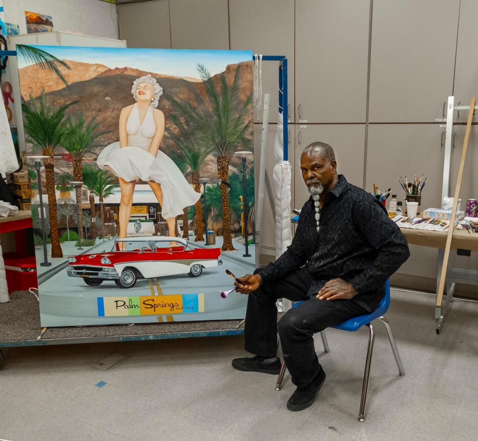 Artist, Mr. Wash, shows a painting he produced specifically for the 'Outbursts' exhibit at The Palm Springs Art Museum