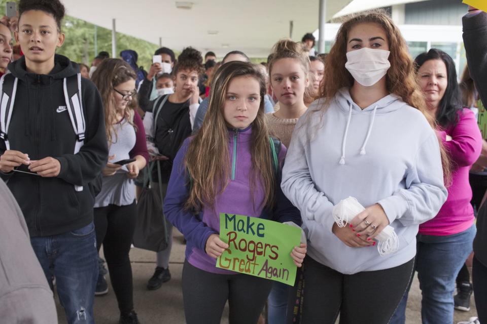 Rogers High School students staged a walkout in 2018 protesting the conditions at the school. Many carried signs and wore masks to highlight the need for a better learning environment.
