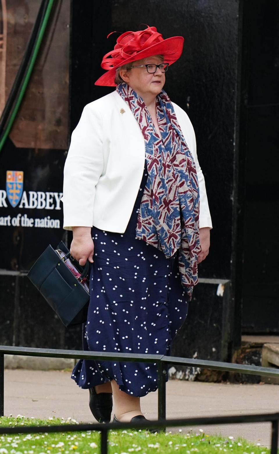 Thérèse Coffey wore a union jack scarf paired with a printed day dress (Getty Images)