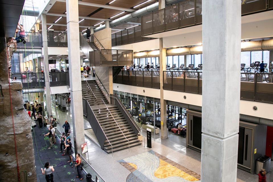 University of Iowa students walk through the Campus Recreation and Wellness Center (CRWC), Thursday, March 24, 2022, in Iowa City, Iowa.