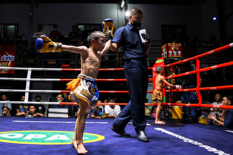 The Wider Image: Punching out of poverty: Despite risks, nine-year-old Thai fighter eager to return to ring