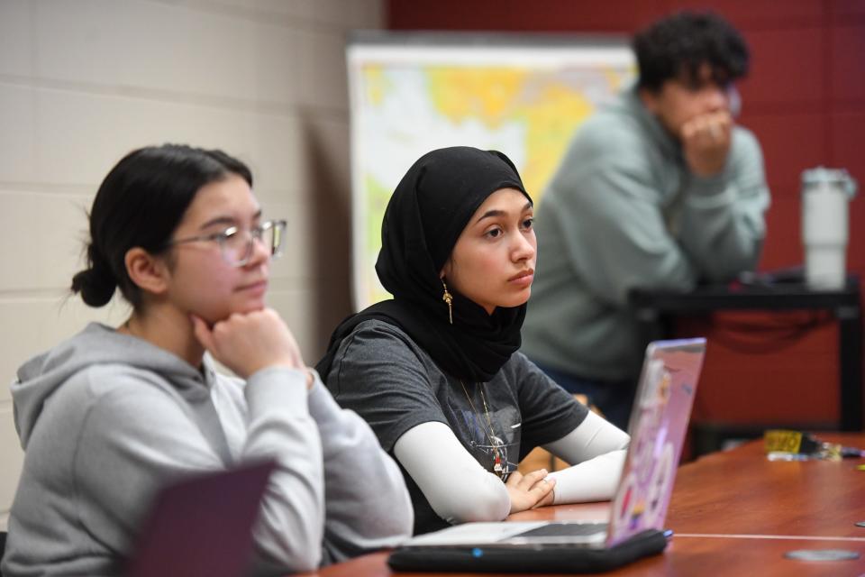 Interfaith Council member Mariam Alinizi listens during weekly council meeting on Tuesday, Feb, 20, 2024 at Augustana Humanities Building in Sioux Falls.