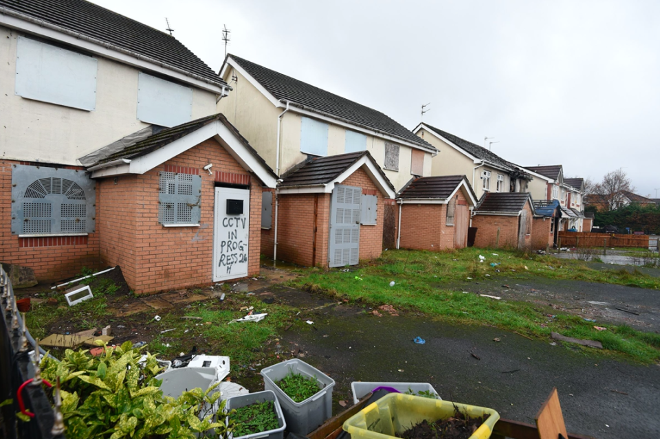 Derelict homes with windows boarded over, graffiti and rubbish on the ground are a feature of properties on Primrose Court. (Reach)