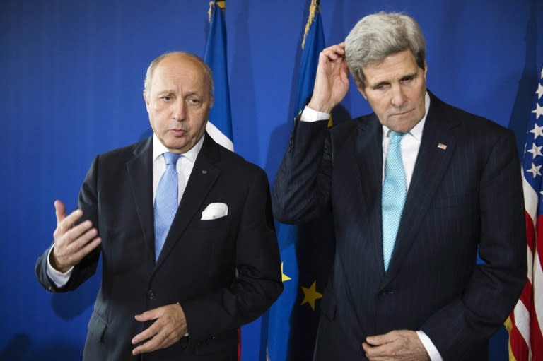 French Foreign Minister Laurent Fabius (left) and US Secretary of State John Kerry speak to the press following a 2014 meeting at the Quai d'Orsay in Paris