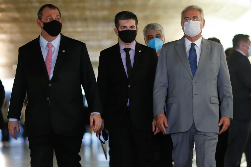 Brazilian Senators Omar Aziz, Randolfe Rodrigues and Renan Calheiros walk after a meeting of the Parliamentary Inquiry Committee&#xa0;(CPI) to investigate government actions and management during the coronavirus disease (COVID-19) pandemic, at the Federal Senate in Brasilia, Brazil April 27, 2021. REUTERS/Adriano Machado