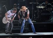 NASHVILLE, TN - NOVEMBER 01: Jason Aldean (R) performs during the 46th annual CMA Awards at the Bridgestone Arena on November 1, 2012 in Nashville, Tennessee. (Photo by Jason Kempin/Getty Images)