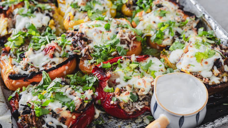 southwest turkey and cheese stuffed peppers on baking sheet