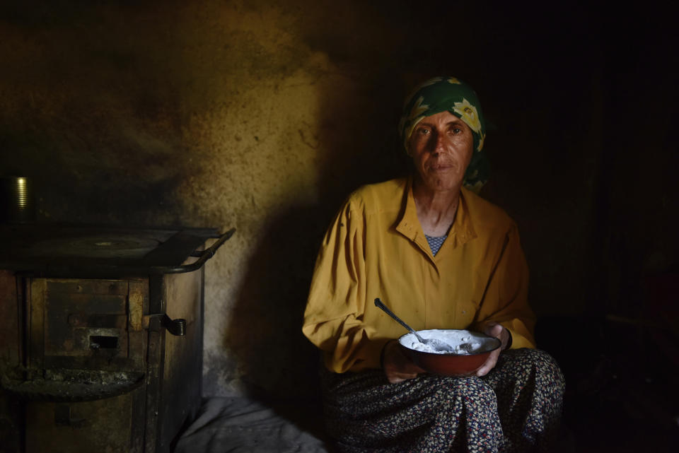 This image released by Neon shows Hatidze Muratova in a scene from "Honeyland," nominated for an Oscar for best documentary and best international feature film. (Neon via AP)