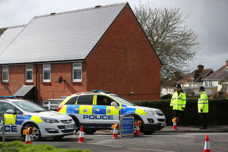 Police officers guard the cordoned off area around the home of former Russian intelligence officer Sergei Skripal in Salisbury, Britain, April 3, 2018. REUTERS/Hannah McKay