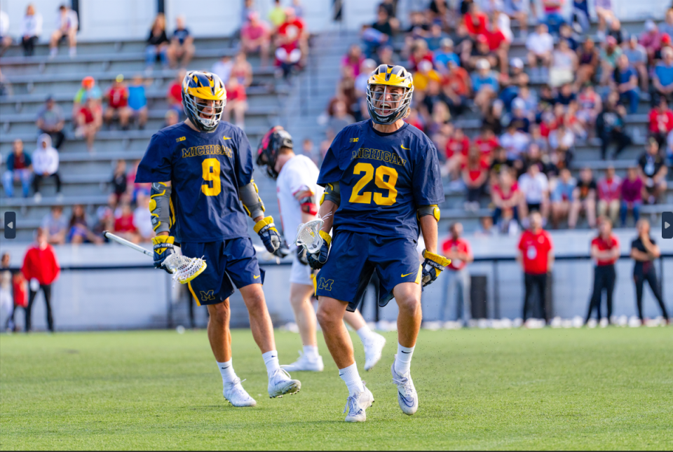 Michigan's Peter Thompson and Josh Zawada celebrate in the Big Ten lacrosse tournament championship against Maryland on May 6 at Homewood Field in Baltimore, Maryland